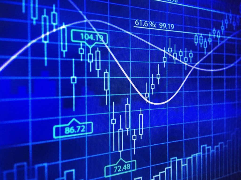 Graphs and plots layered on a blue digital screen