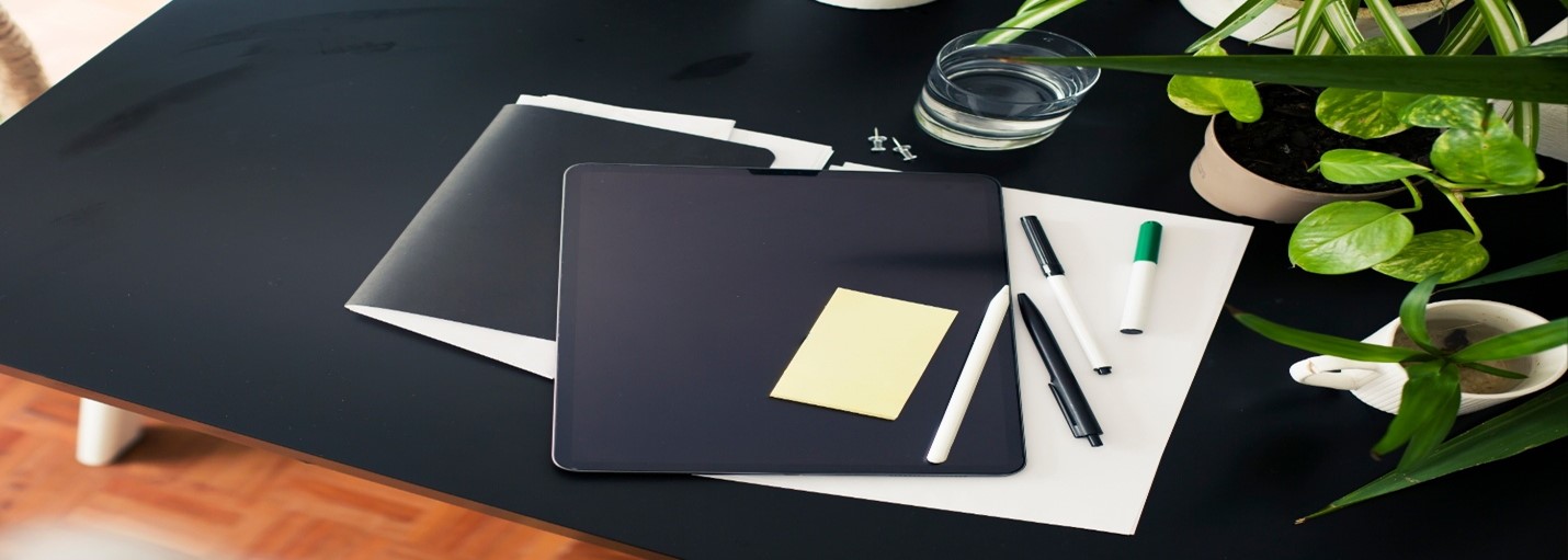 Tablet and documents on table