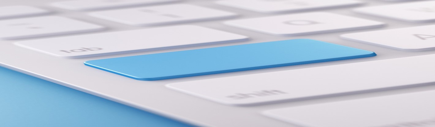 Close-up of blue key on white keyboard