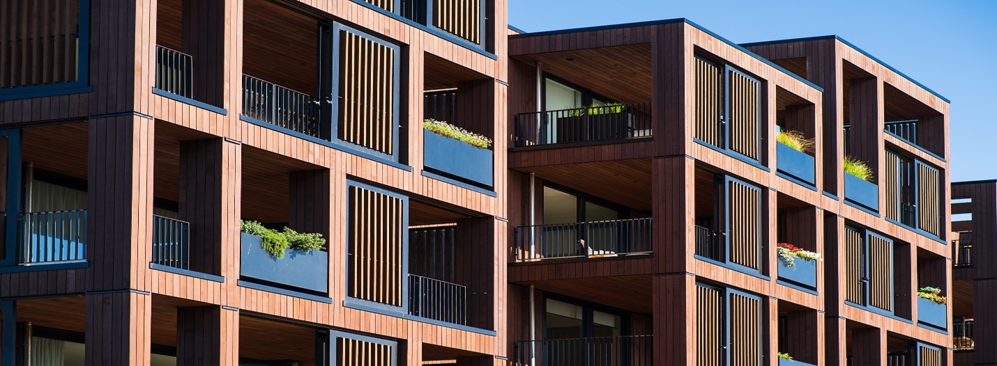 Residential complex of apartment buildings with doors leading to balconies