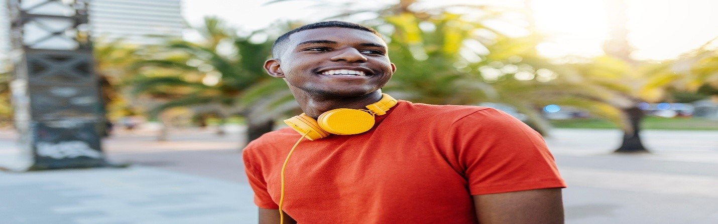 Smiling man with yellow headphones