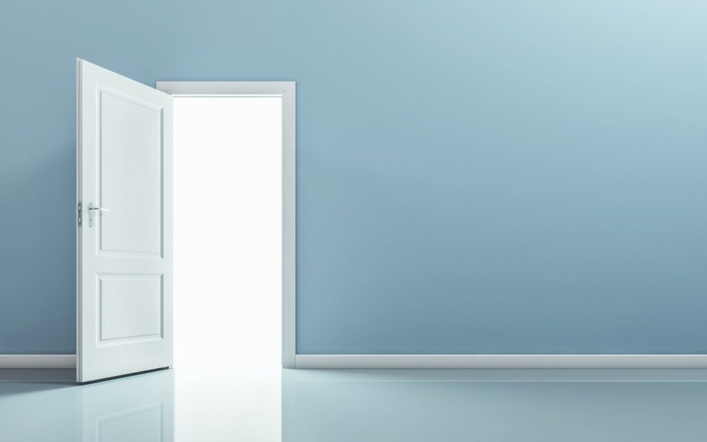 An open door on a blue wall