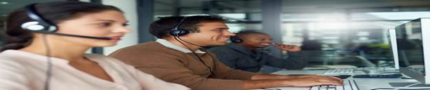 People wearing headphones working on computers