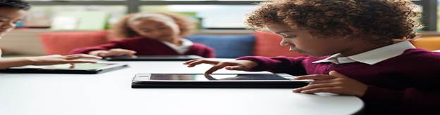 Children with tablets at school