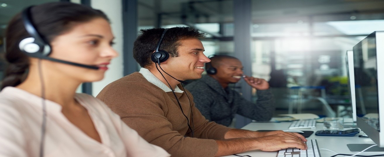 People wearing headphones working on computers